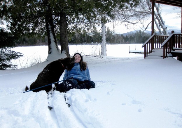 Brigid takes a ski break with a furry friend.